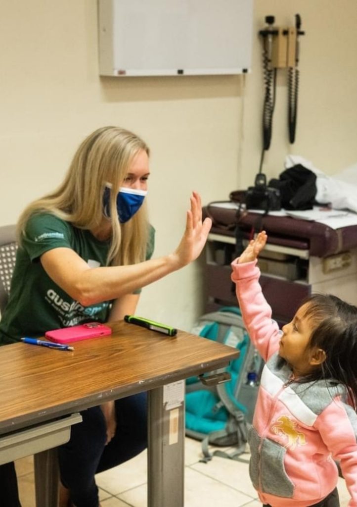 Dr. Crawford giving child high five